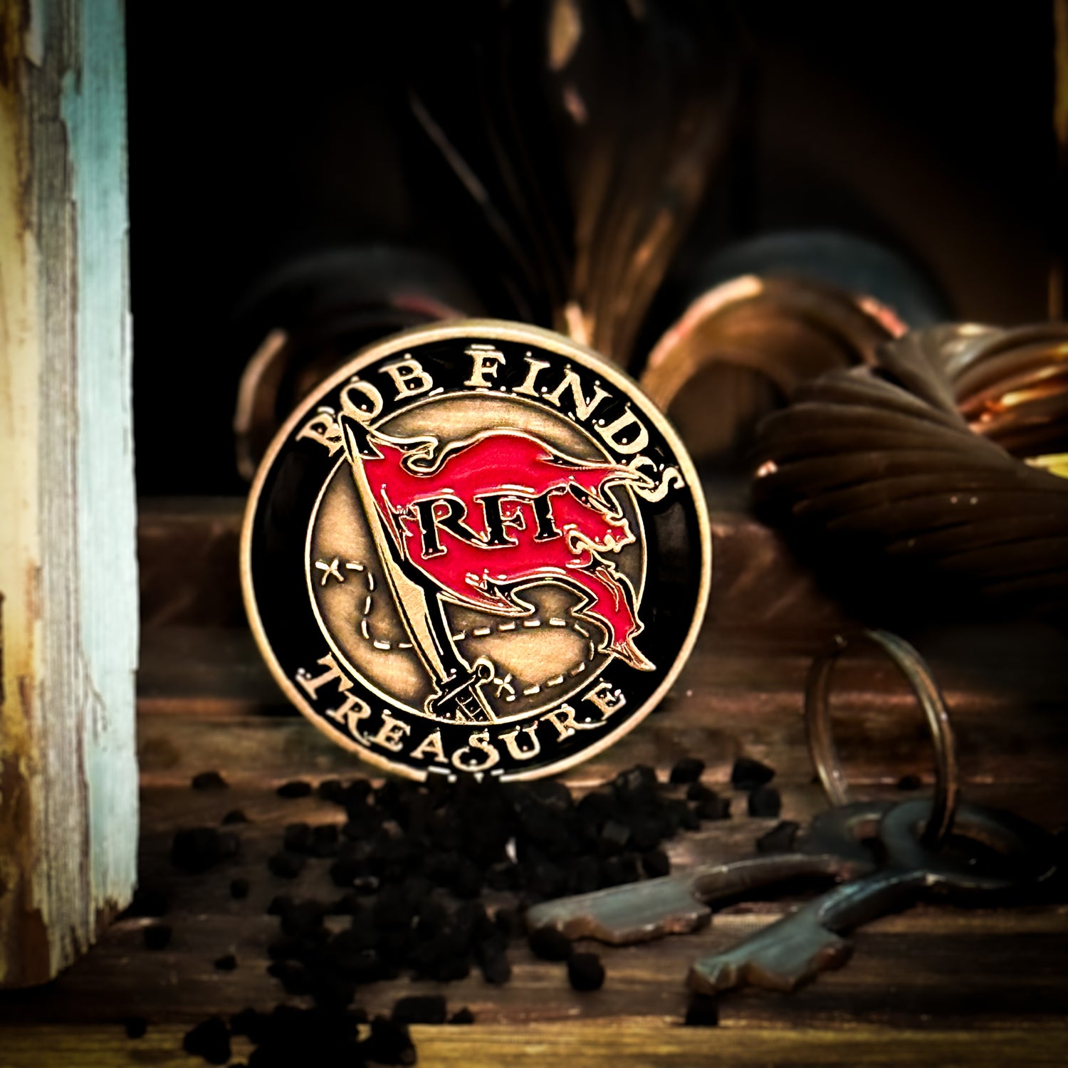 Rob Finds Treasure Bronze Challenge Coin with background, front view