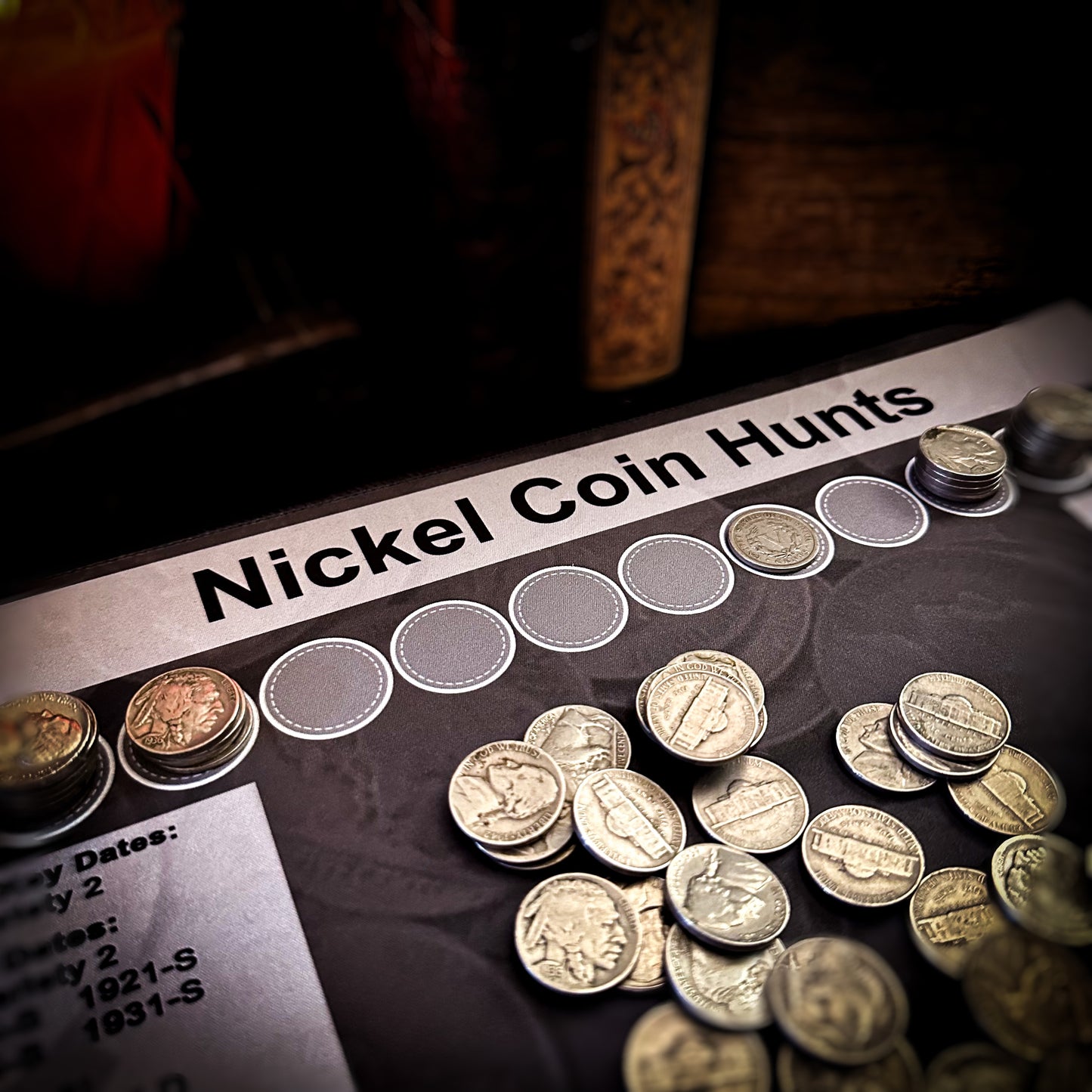 Close up of a layout with coins of a nickel coin roll hunting mat made by Rob Finds Treasure featuring organized rows for stacking nickels, providing a convenient and systematic setup for searching through coins